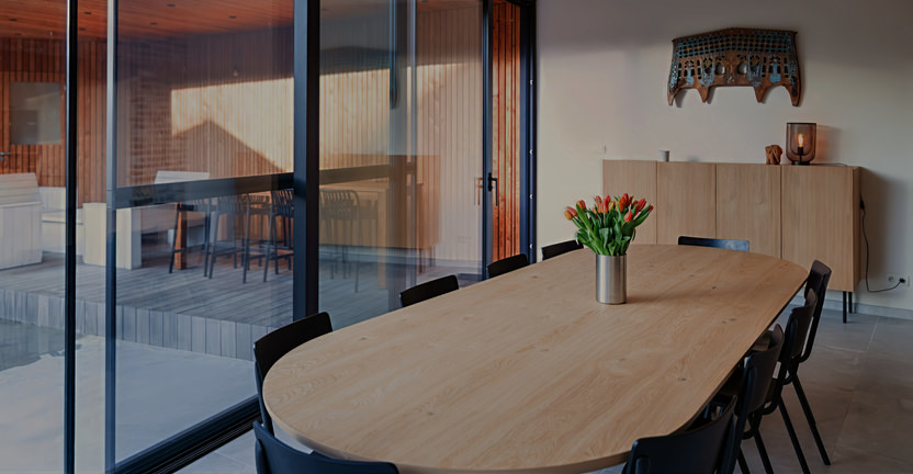 Holiday home Remersdaal Dining table overlooking the garden